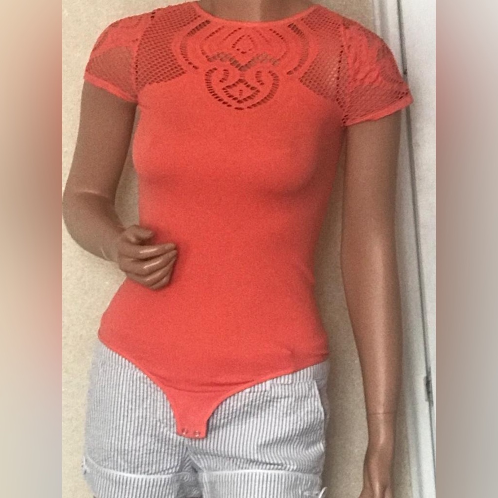 Bebe salmon orange body suit top in size M. In gently used condition.